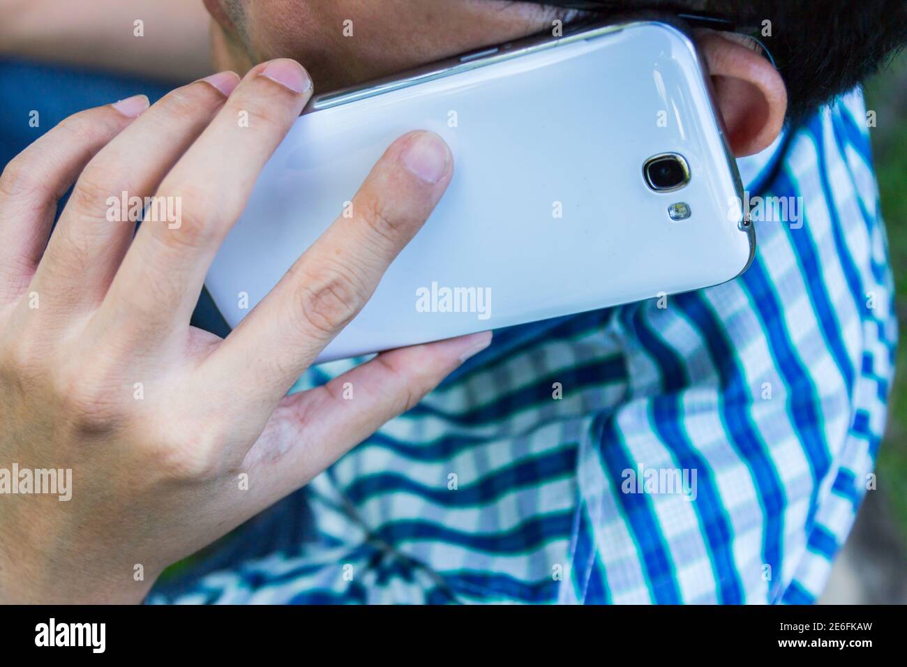 Close up man using mobile smart phone background Stock Photo - Alamy