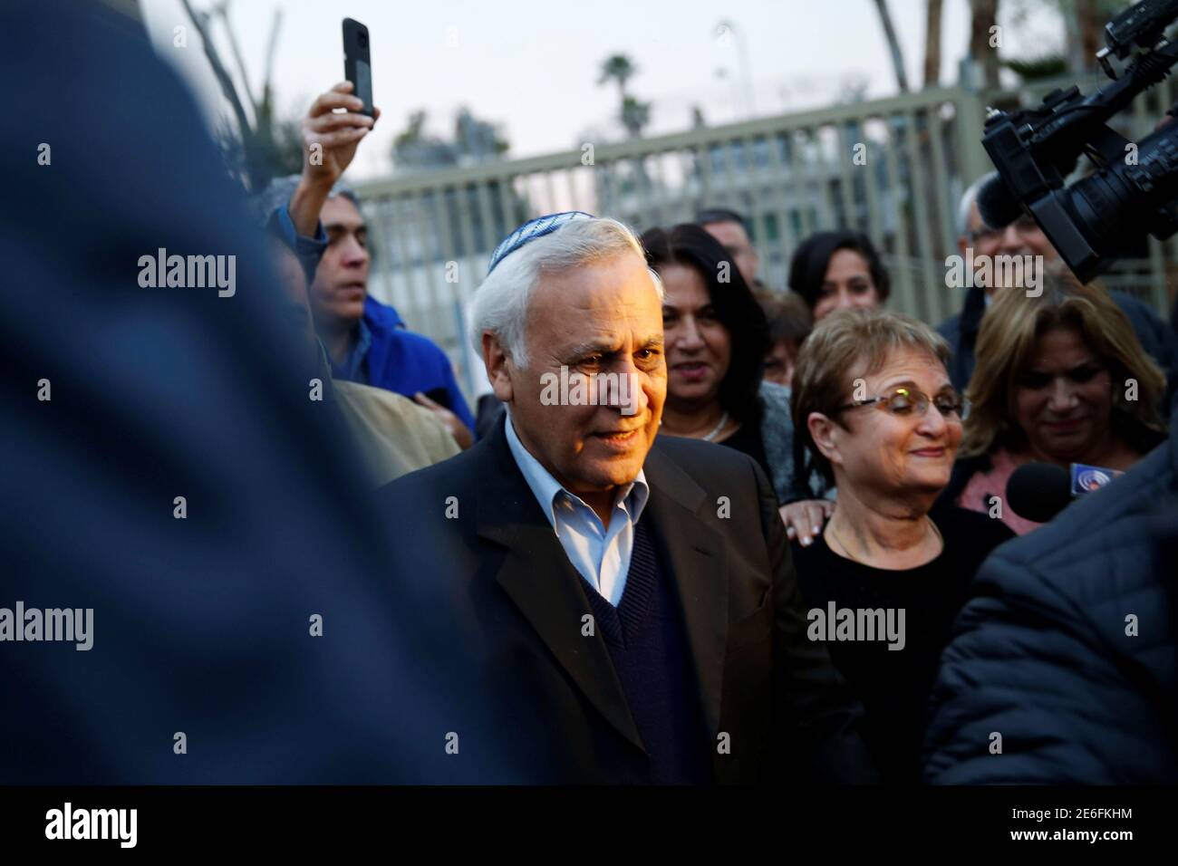 Former Israeli President Moshe Katsav (C) leaves the Maasiyahu prison, as he was released on parole after serving five years of his seven-year sentence, in Ramle, Israel December 21, 2016. REUTERS/Baz Ratner Stock Photo
