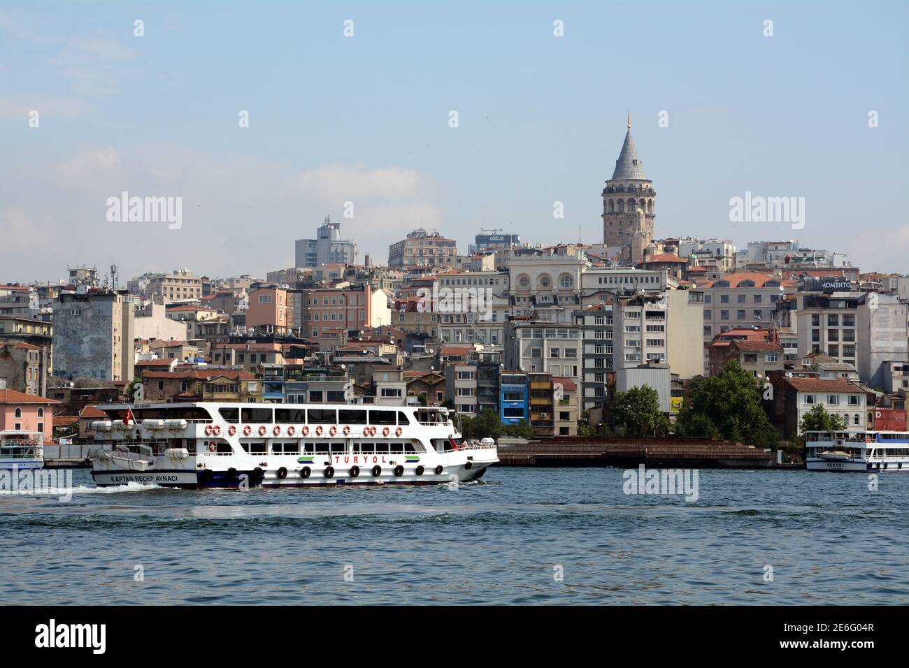 Galata tower and surrounding buildings looking across the golden horn from Eminonu in Istanbul, Turkey. Stock Photo