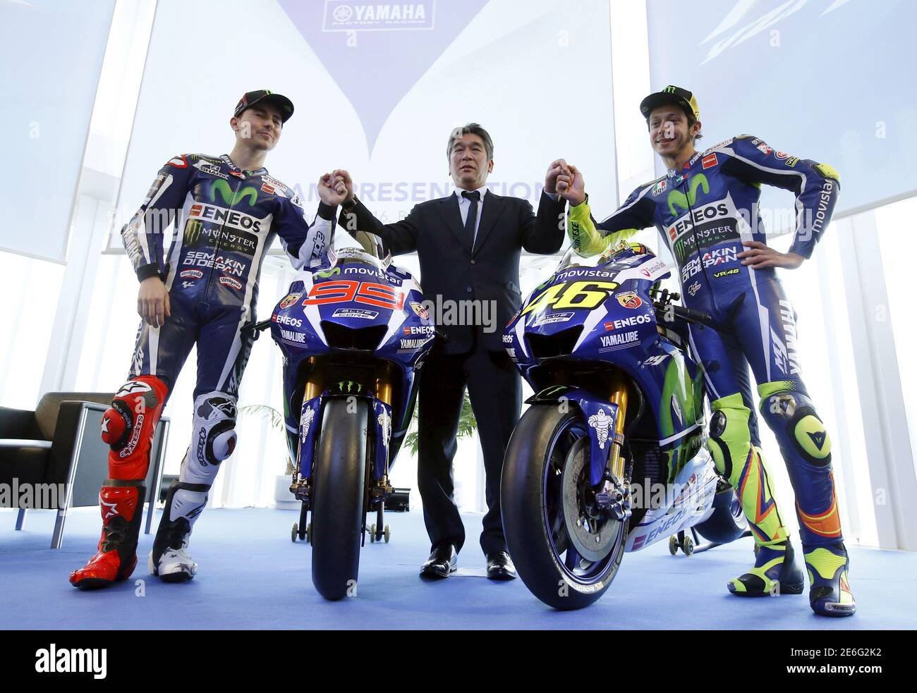 Yamaha's MotoGP riders Jorge Lorenzo (L), Valentino Rossi (R) and Yamaha  MotoGP General Manager Tsuji Kouichi (C) pose with the new Yamaha YZR-M1  for the 2016 season in Barcelona, Spain, January 18,