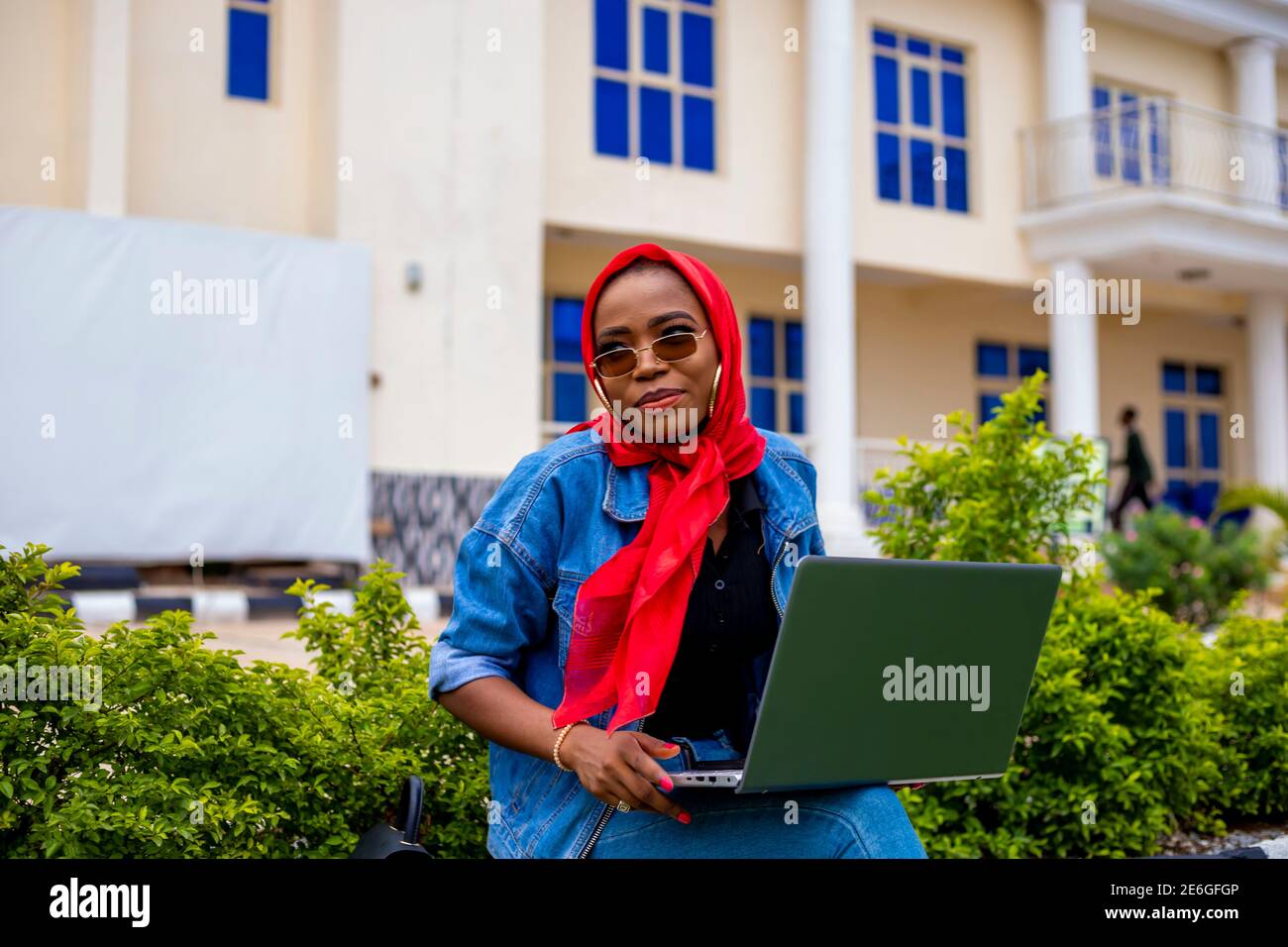 young black beautiful lady sitting out and working on her laptop Stock ...