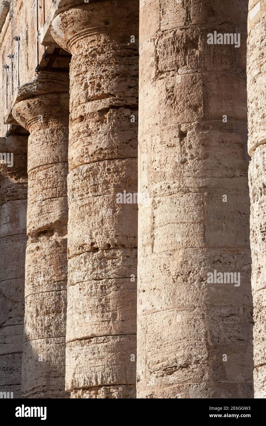 Columns of the Doric temple of Segesta in warm evening light, Sicily, Italy Stock Photo