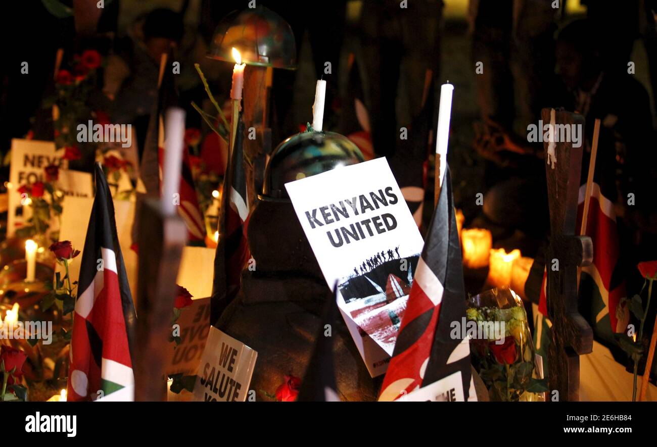 Lighted candles and placards are seen at the 'Freedom Corner' in Nairobi during a memorial vigil for Kenyan soldiers serving in the African Union Mission in Somalia (AMISOM) who were killed during an attack last week,  January 21, 2016. Al Shabaab, which is aligned with al Qaeda, said its fighters killed more than 100 Kenyan soldiers when they overrun the base in Ceel Cadde, near the Kenyan border, on Jan 15. REUTERS/Thomas Mukoya Stock Photo