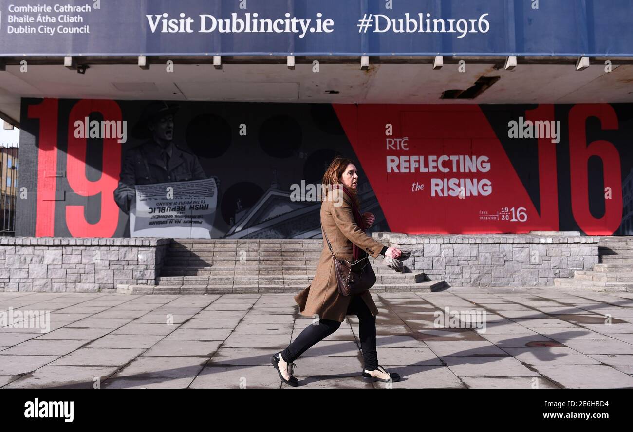 A woman walks past a mural marking the 100 year anniversary of the Irish Easter Rising in Dublin, Ireland, March 27, 2016.  REUTERS/Clodagh Kilcoyne Stock Photo