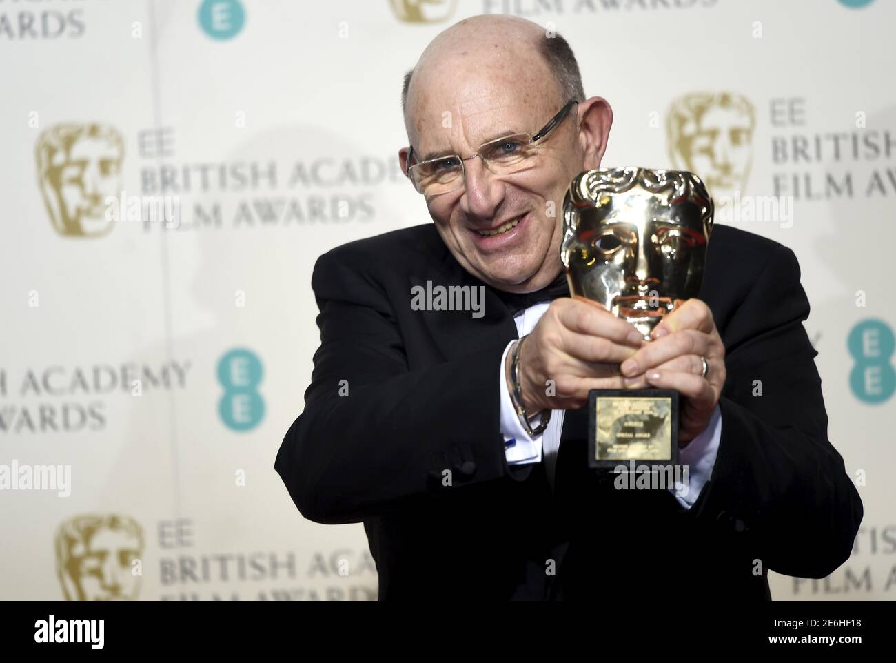 Tim Angel of Angels Costumes holds his award for outstanding contribution to British cinema at the British Academy of Film and Television Arts (BAFTA) Awards at the Royal Opera House in London, February 14, 2016. REUTERS/Toby Melville Stock Photo