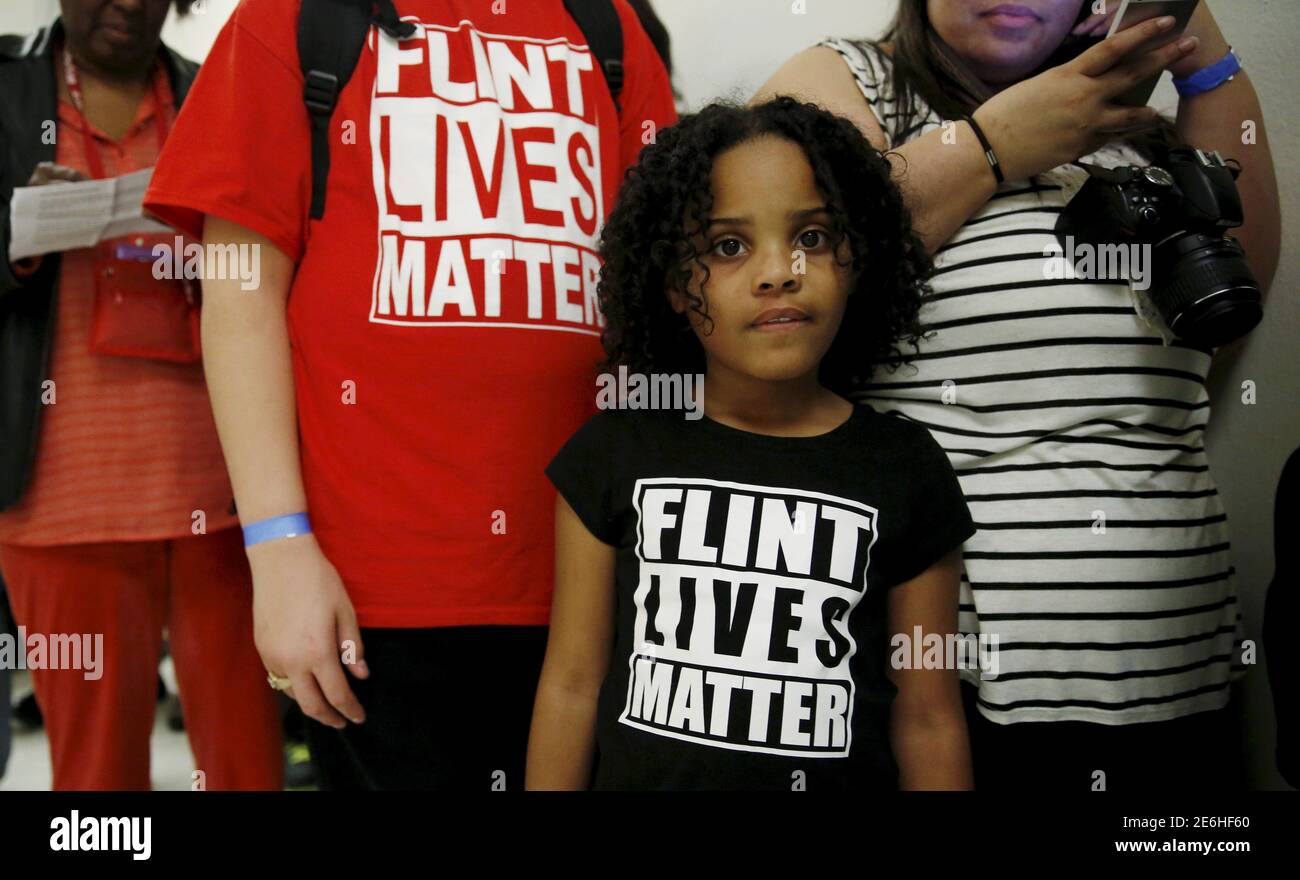 Mari Copeny, 8, of Flint, Michigan, waits in line to enter a hearing room where Michigan Governor Rick Snyder (R) and EPA Administrator Gina McCarthy will testify before a House Oversight and government Reform hearing on 'Examining Federal Administration of the Safe Drinking Water Act in Flint, Michigan, Part III'  on Capitol Hill in Washington in this March 17, 2016, file photo. Beyond the liability protection enjoyed by government officials, Flint residents who have filed lawsuits over the contaminated water may face challenges in demonstrating that it caused any particular injuries, lawyers Stock Photo