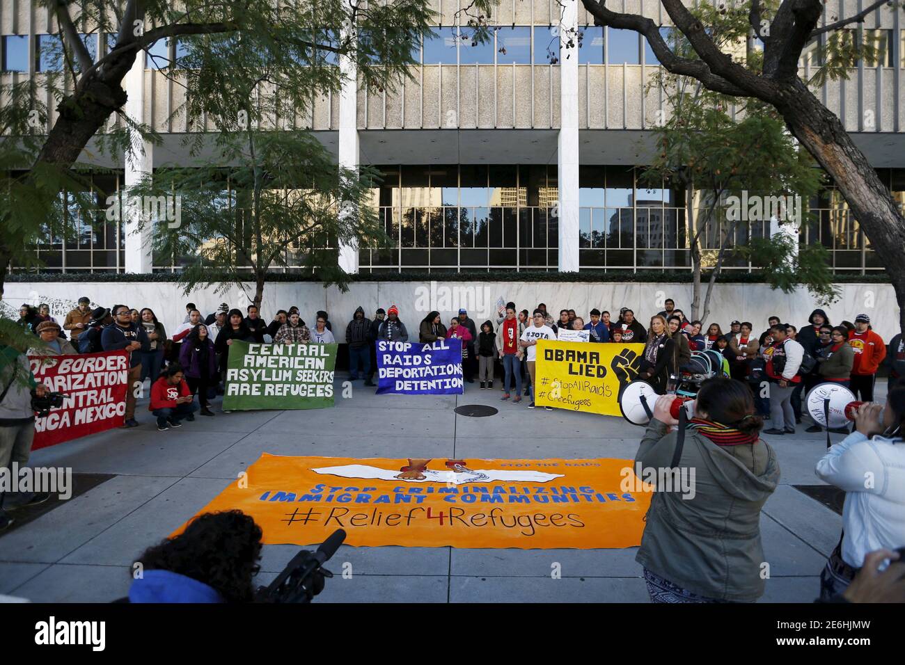 Activist gather outside a Federal Building while protesting against Immigration and Customs Enforcement (ICE) raids on Central American refugees in Los Angeles, California January 26, 2016.   REUTERS/Mario Anzuoni Stock Photo