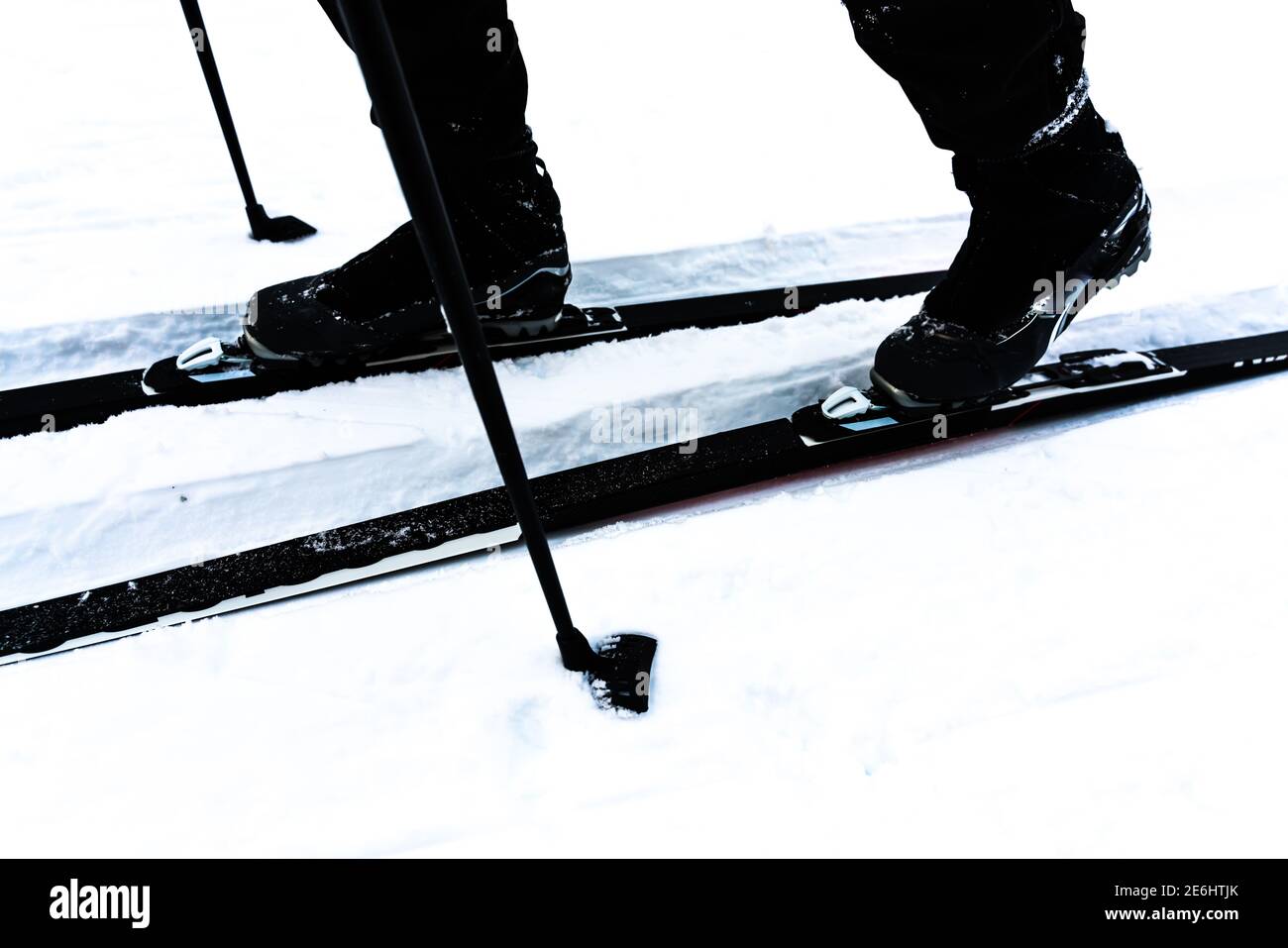 Cross-country skiing boots, poles and skis, close up image. Stock Photo