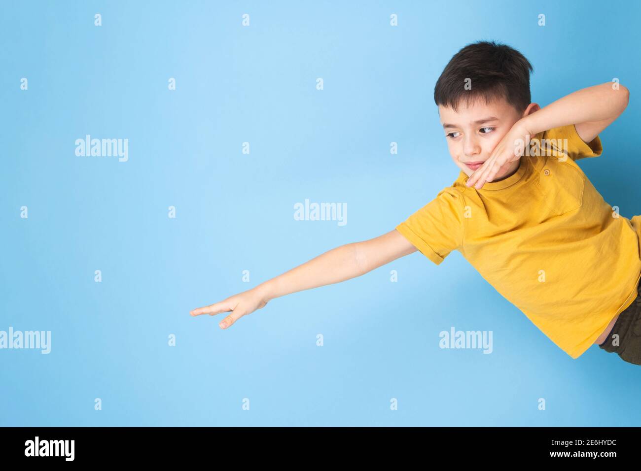 a child imagines flying through the sky Stock Photo