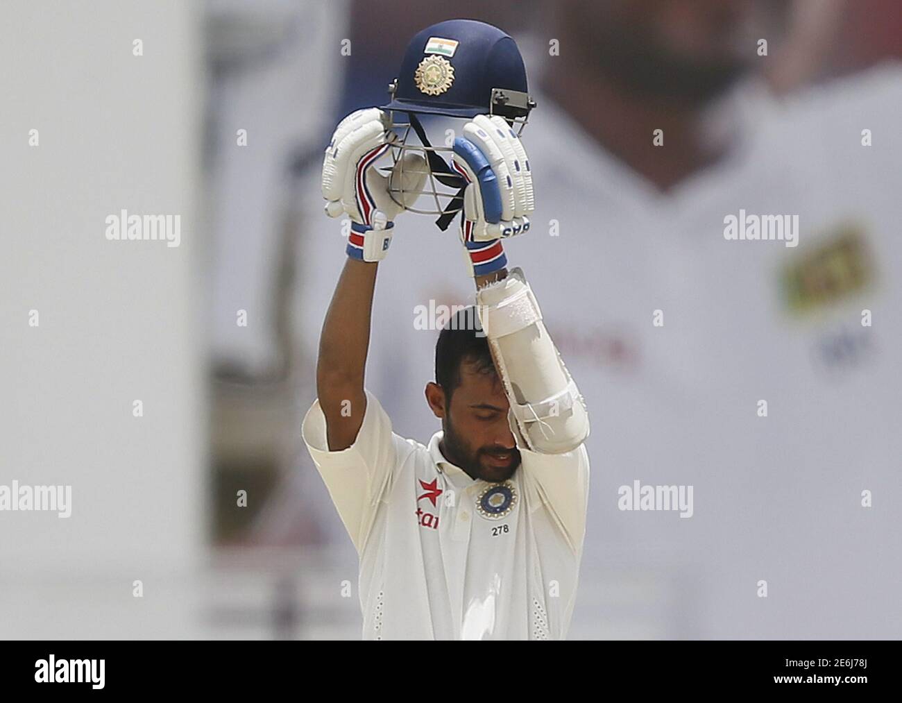 India's Ajinkya Rahane wipes his face during the fourth day of their second test cricket match against Sri Lanka in Colombo August 23, 2015. REUTERS/Dinuka Liyanawatte Stock Photo