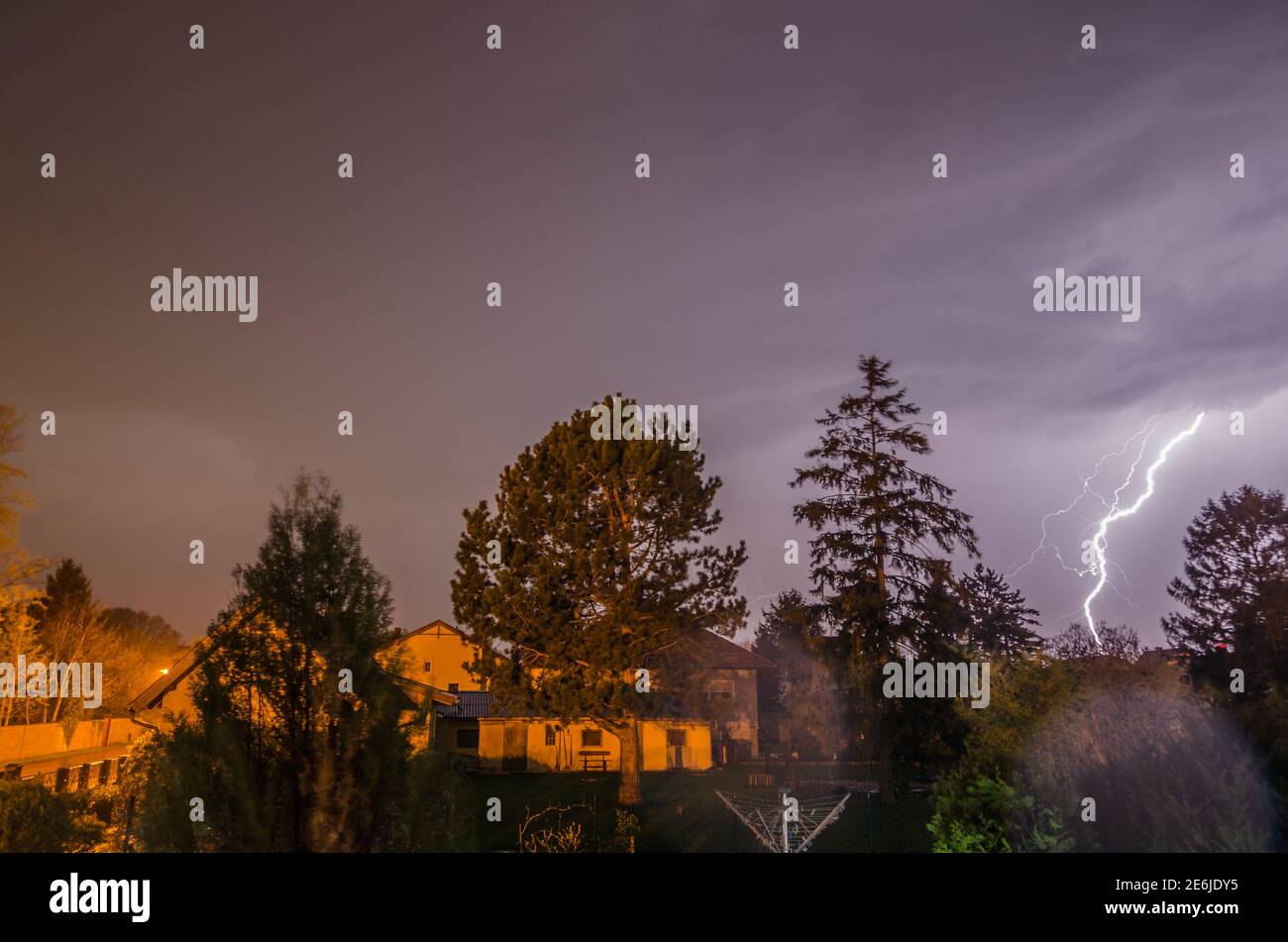 bright lightning strikes at night Stock Photo