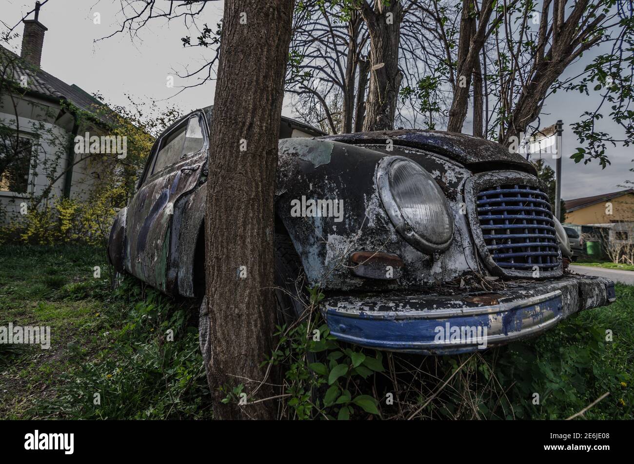 old colorful oldtimer between trees Stock Photo - Alamy