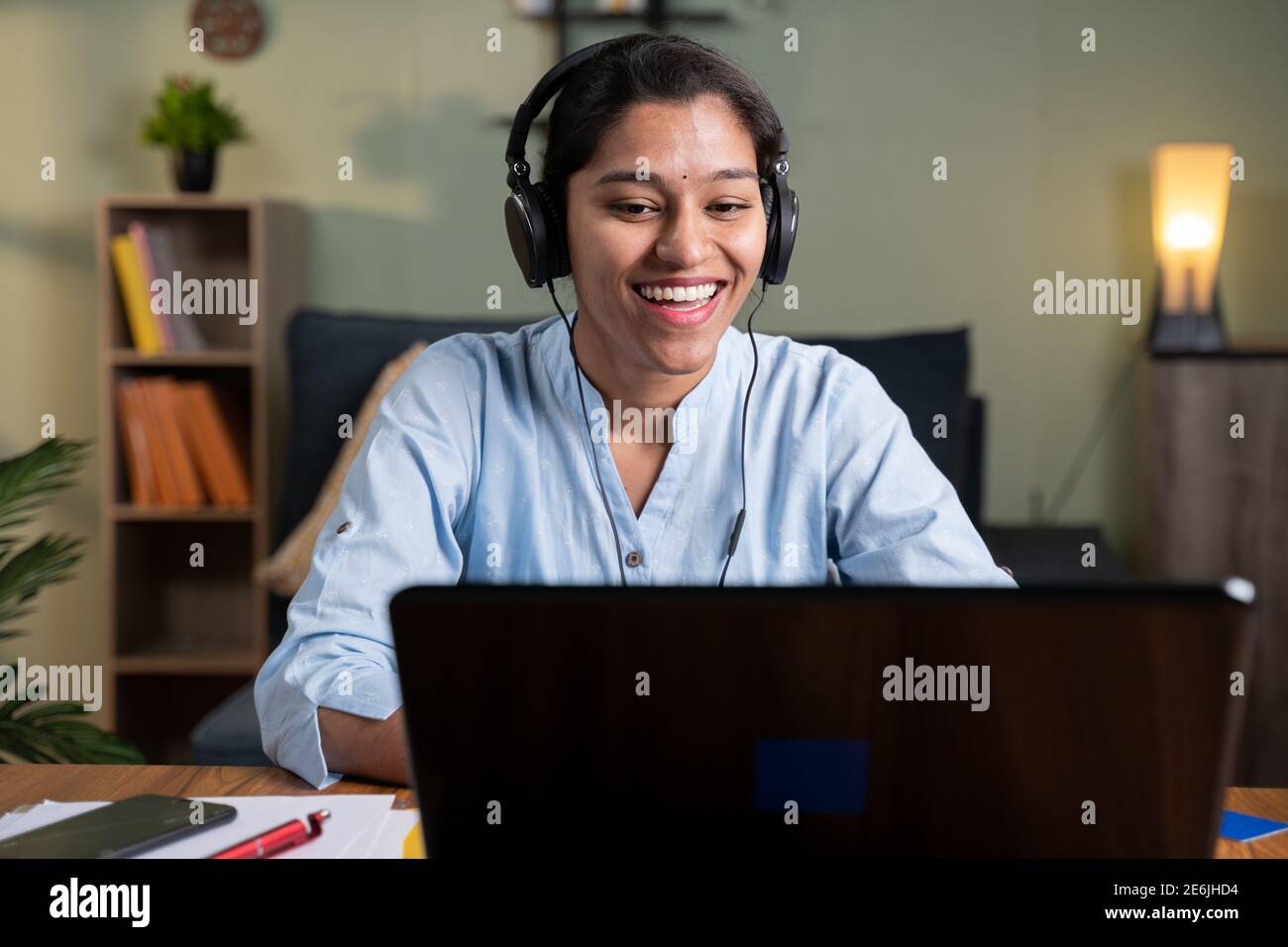 Happy smiling young Business woman with headphone in video call on ...