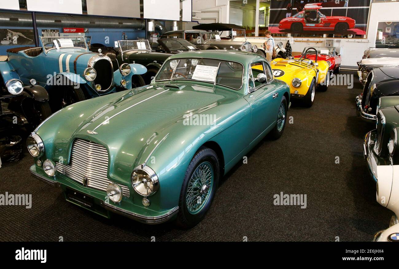 A 1952 Aston Martin DB 2 Vantage Specification (front) is shown with other  vintage cars during