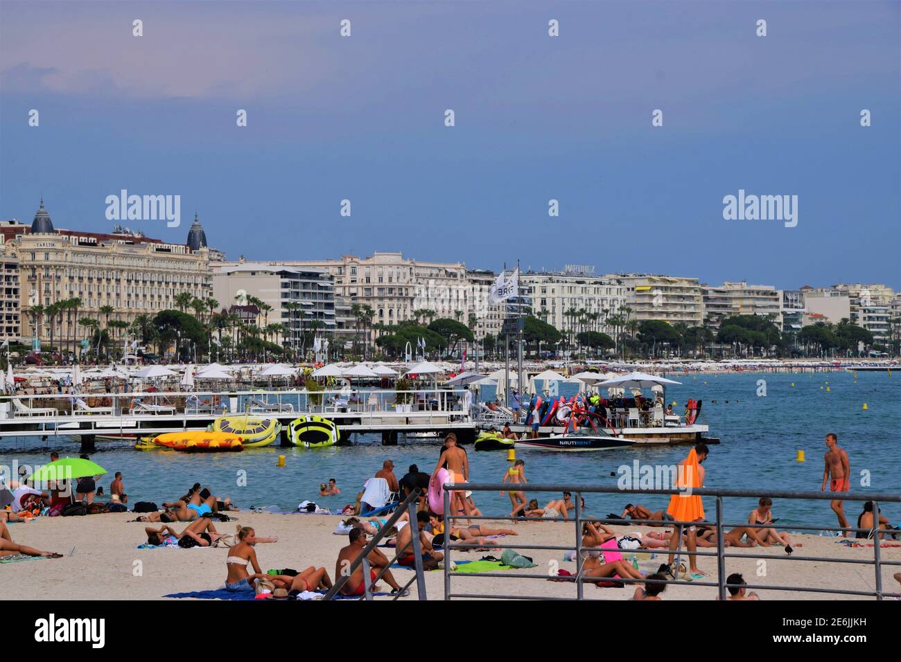 Crowd of people on the beach in Cannes, South of France Stock Photo - Alamy