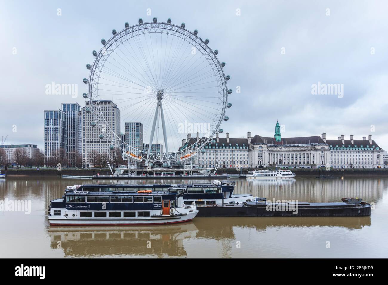 The River Thames, London Eye viewing wheel, county Hall building (London Aquarium) shell building and tour boats, Westminster, London Stock Photo