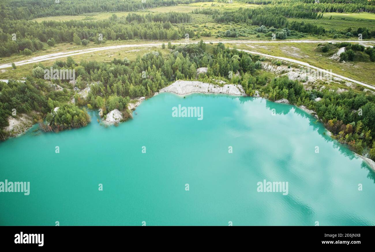 Quarry in natural landscape aerial drone view on sunny day Stock Photo