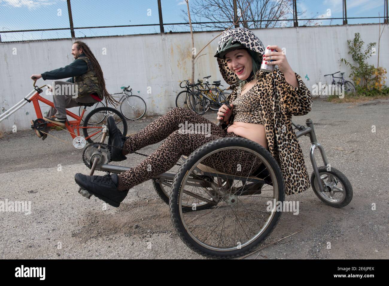 A woman rides a custom bike during 