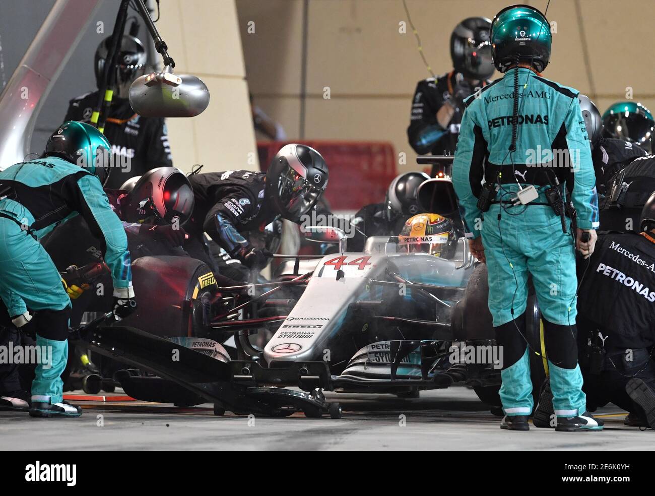 Formula One - F1 - Bahrain Grand Prix - Sakhir, Bahrain - 16/04/17 - Pit  crew and mechanics surround Mercedes' driver Lewis Hamilton of Britain in  the pit lane. REUTERS/Andrej Isakovic/Pool Stock Photo - Alamy