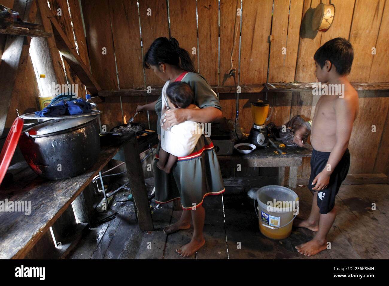 Cofan indigenous people are seen on their labours in their homes in the Quichua community at Dureno, Ecuador March 26, 2016.    REUTERS/Guillermo Granja Stock Photo