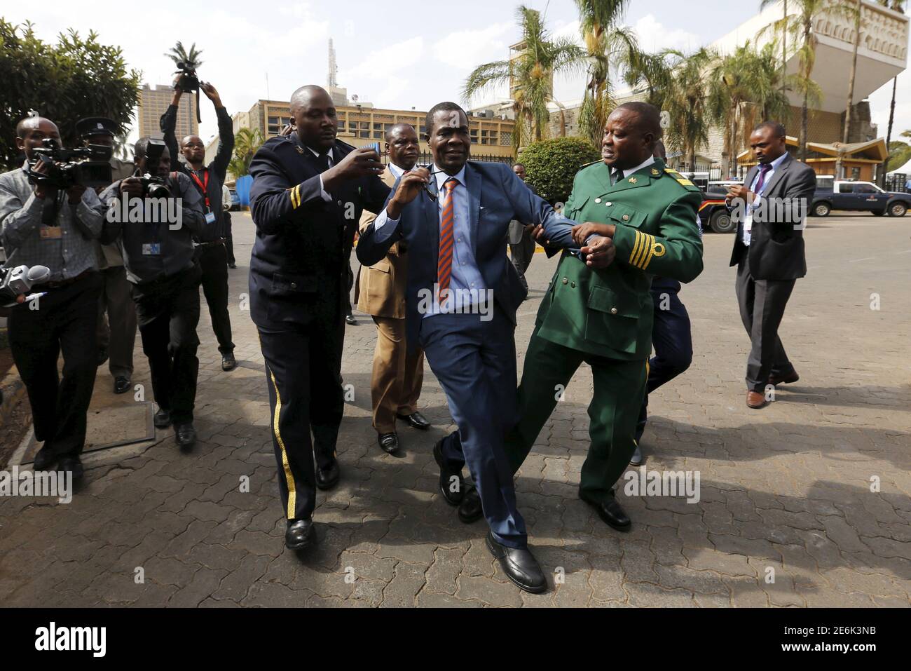 Kenyan Member of Parliament for Ugujna Constituency Opiyo Wandayi (C) is ejected from the National Assembly for blowing whistles during President Uhuru Kenyatta's annual State of the Nation address at the Parliament Buildings in the capital Nairobi, March 31, 2016. REUTERS/Thomas Mukoya? Stock Photo