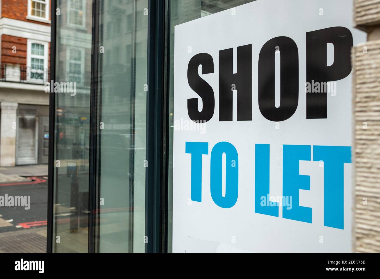 Shop To Let sign on high street window Stock Photo