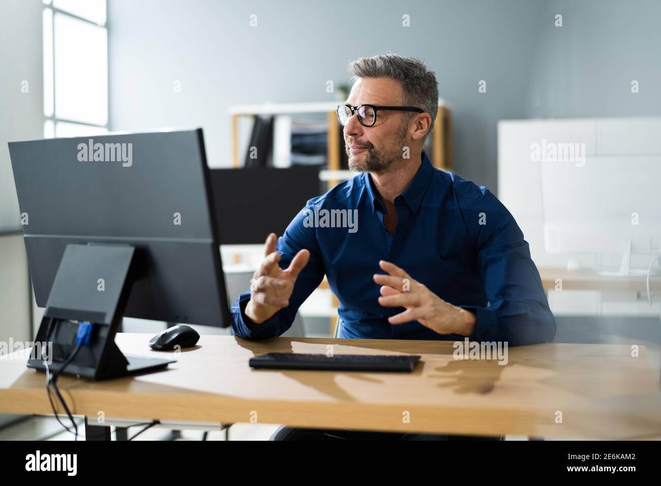 Man Using Online Program Happy older businessman using pc hi-res stock photography and images ...