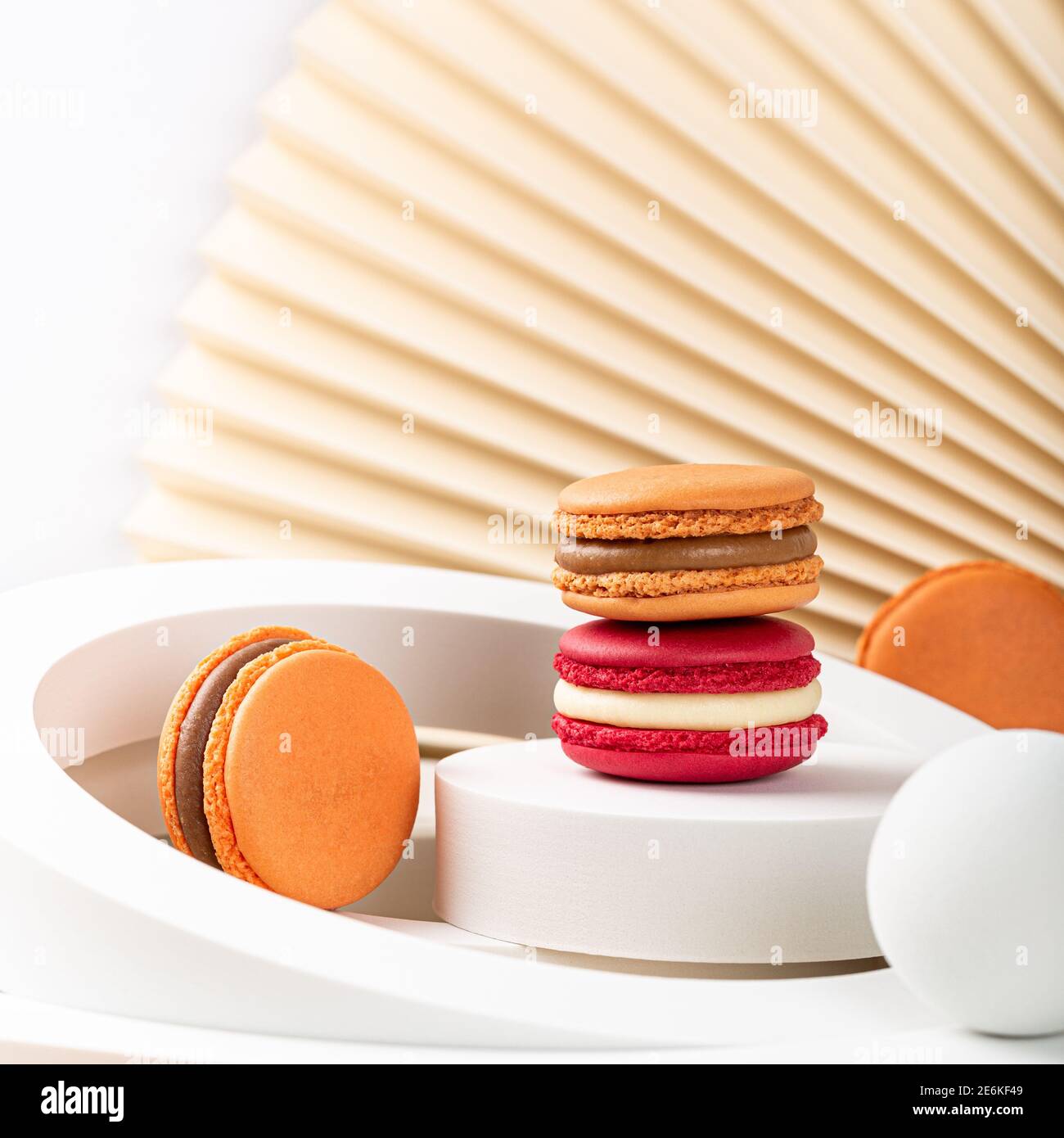 Cake macaron or macaroon on beige background Stock Photo