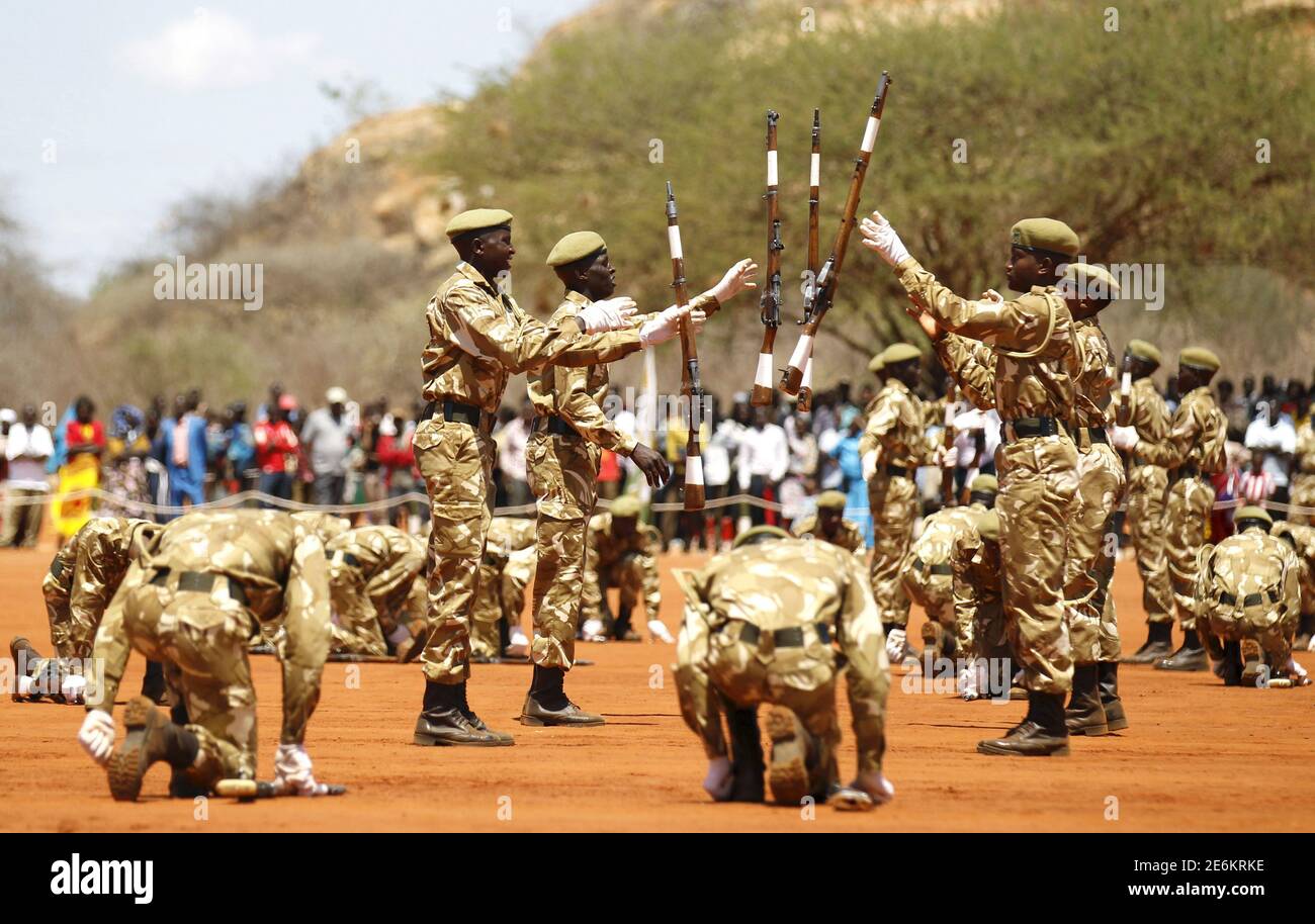 Kenya Wildlife Services (KWS) rangers perform a silent drill during the passing out parade for 592 rangers at the Law Enforcement Academy Manyani in Tsavo West National Park, October 27, 2015. Kenya Wildlife Services Law Enforcement Academy conducts training programs for uniformed personnel including general security courses for staff from institutions outside the wildlife conservation fraternity especially to combat poaching, KWS officials said. Poaching has surged in the last few years across sub-Saharan Africa, where gangs kill elephants and rhinos to feed Asian demand for ivory and horns f Stock Photo