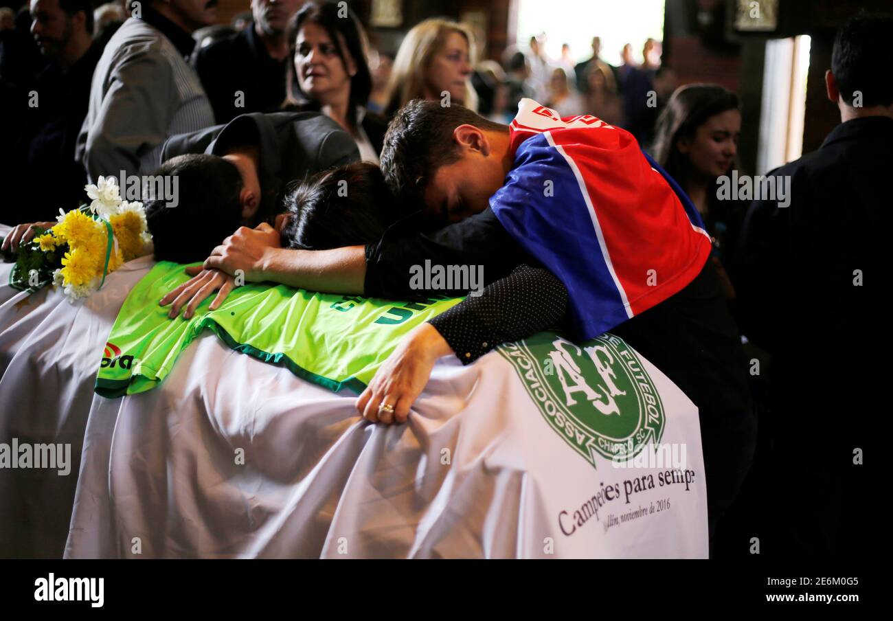 Relatives of Chapecoense soccer club head coach Caio Junior, who died in the plane crash in Colombia, participate in a ceremony to pay tribute to him in Curitiba, Brazil, December 4, 2016. REUTERS/Rodolfo Buhrer Stock Photo