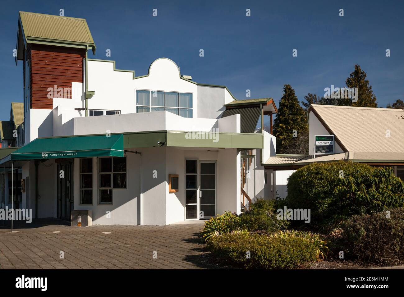 Horizontal shot of a colorful family restaurant exterior on a sunny day, Te Anau, South Island, New Zealand Stock Photo