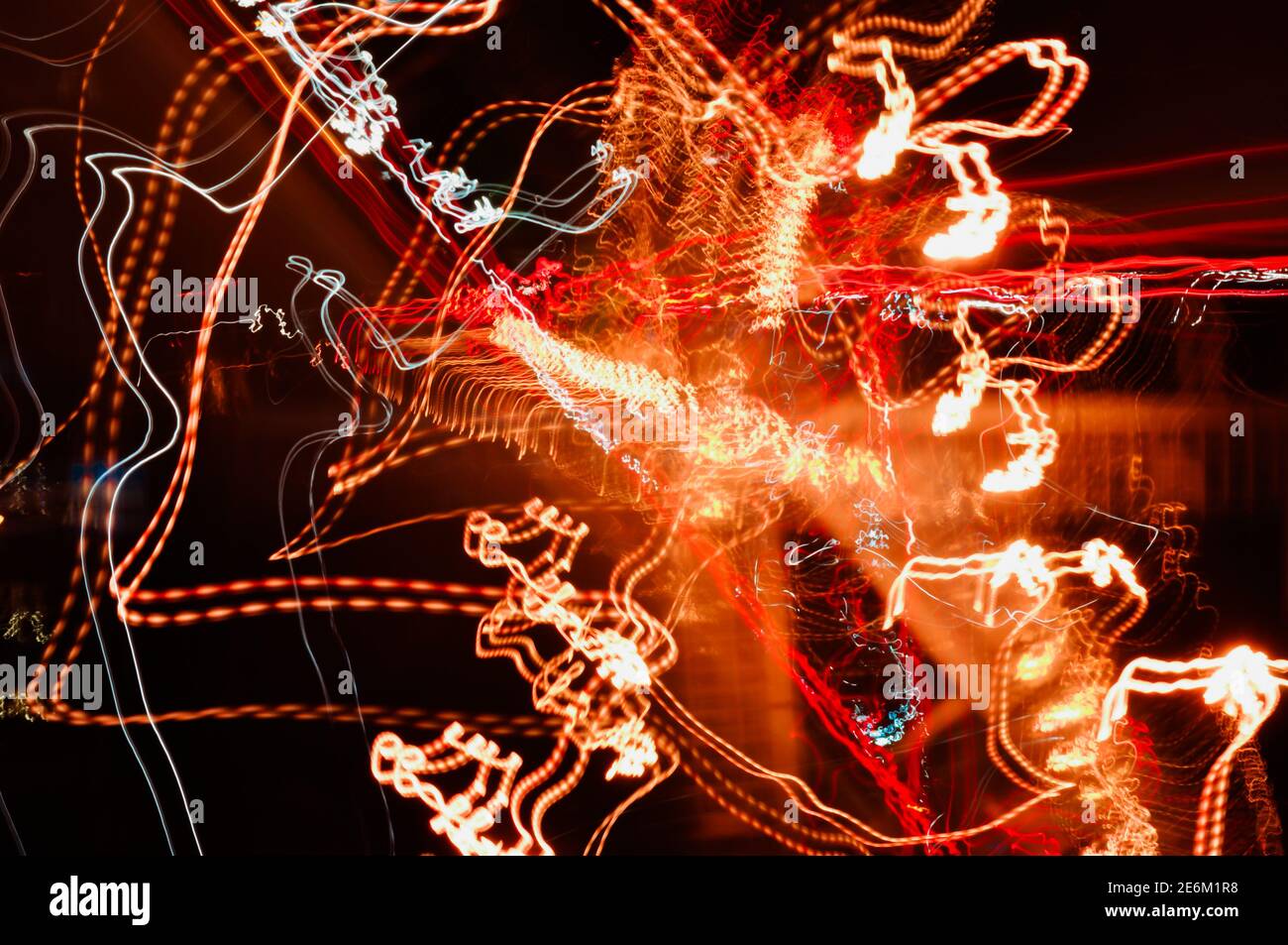 High-speed radial light paths of city lights and car headlights on the