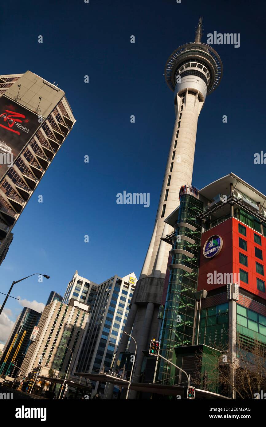 Slanted low angle view of the Sky Tower in Downtown on a sunny day, Auckland, North Island, New Zealand Stock Photo