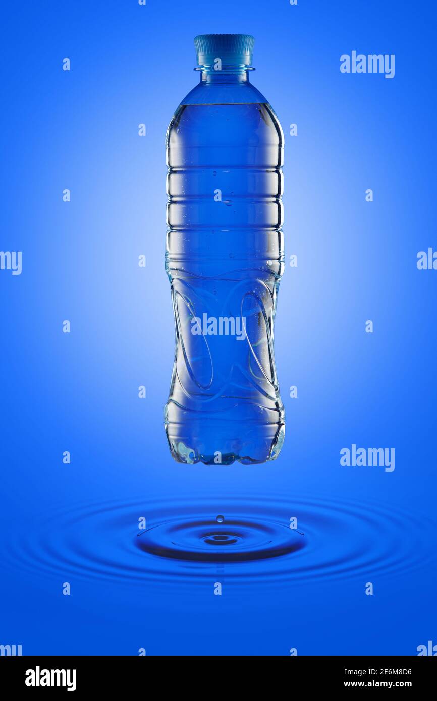 Water in a plastic bottle on a blue background with circular waves Stock  Photo - Alamy