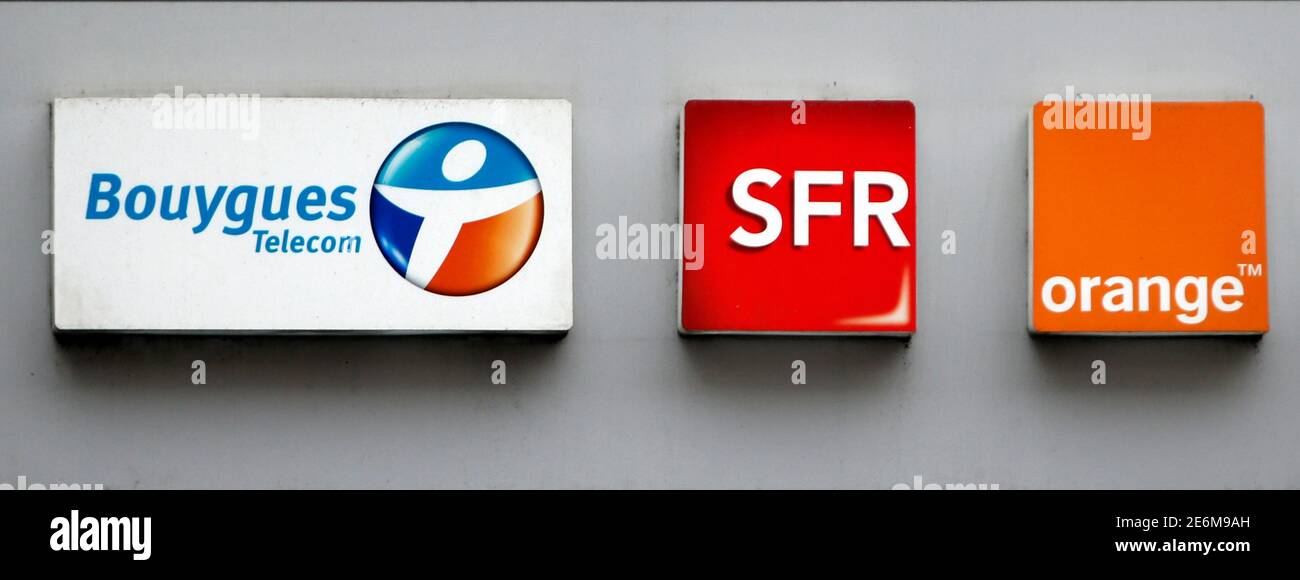 French telecom operators Bouygues Telecom, SFR, and Orange logos are seen  on a mobile phone store front in Paris, France, December 15, 2015. France's  Economy Minister said on Monday he did not