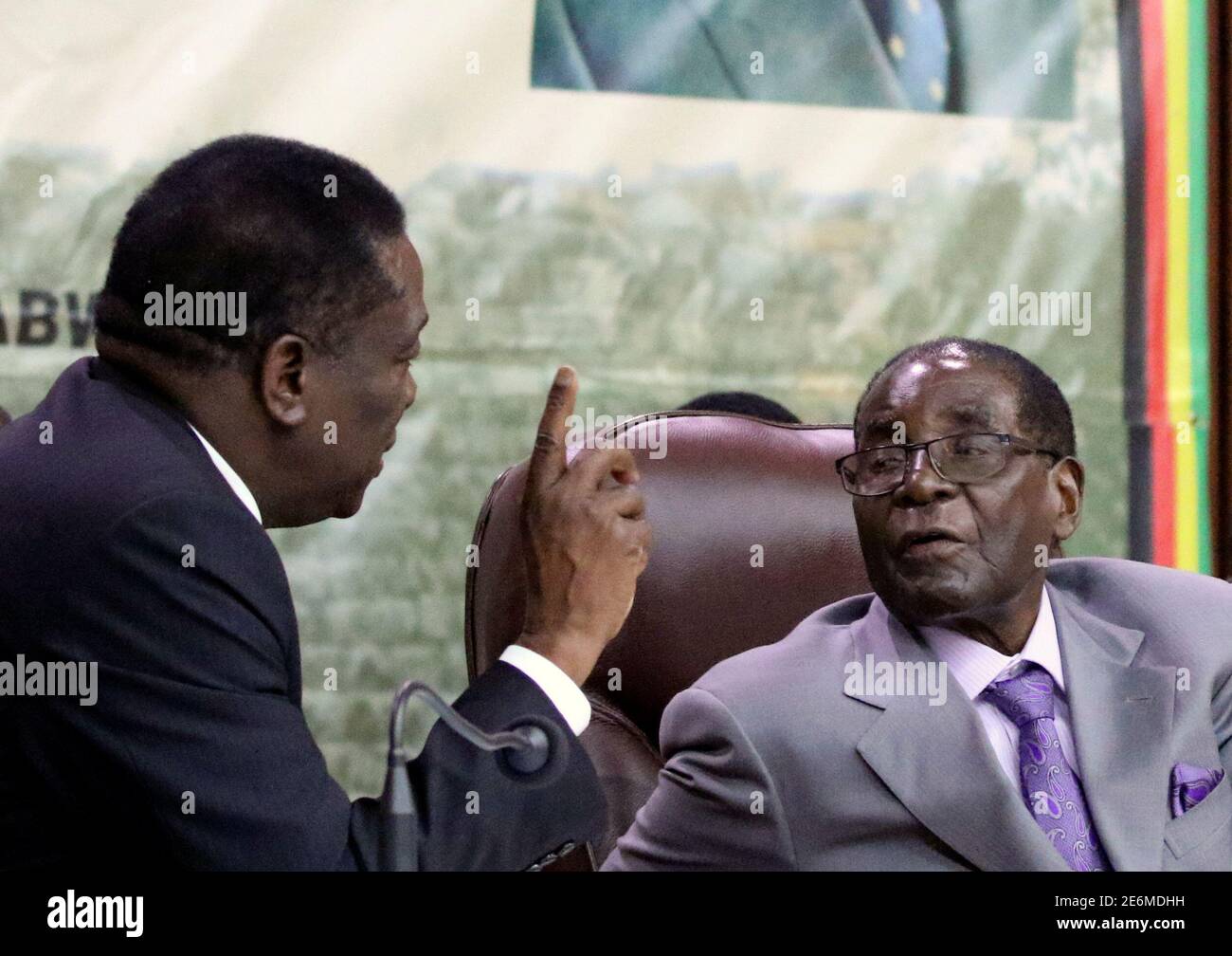 Zimbabwe's President Robert Mugabe speaks to Vice-President of Zimbabwe  Emmerson Mnangagwa during a meeting of Central Committee, the decision  making body of his ruling ZANU PF party, in Harare, Zimbabwe, September 9,