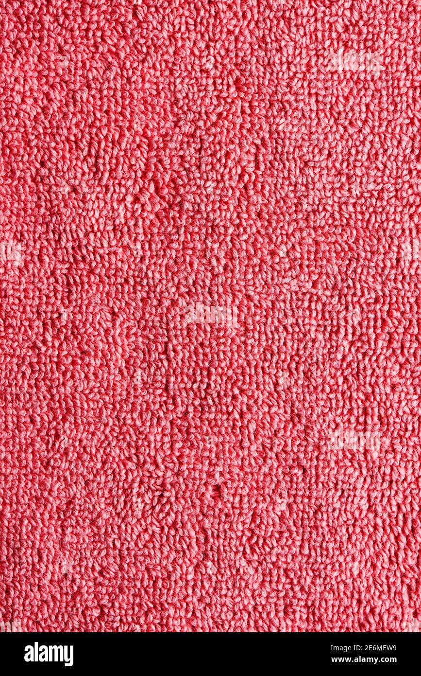 closeup of a coral pink terrycloth fabric to be used as a background Stock Photo