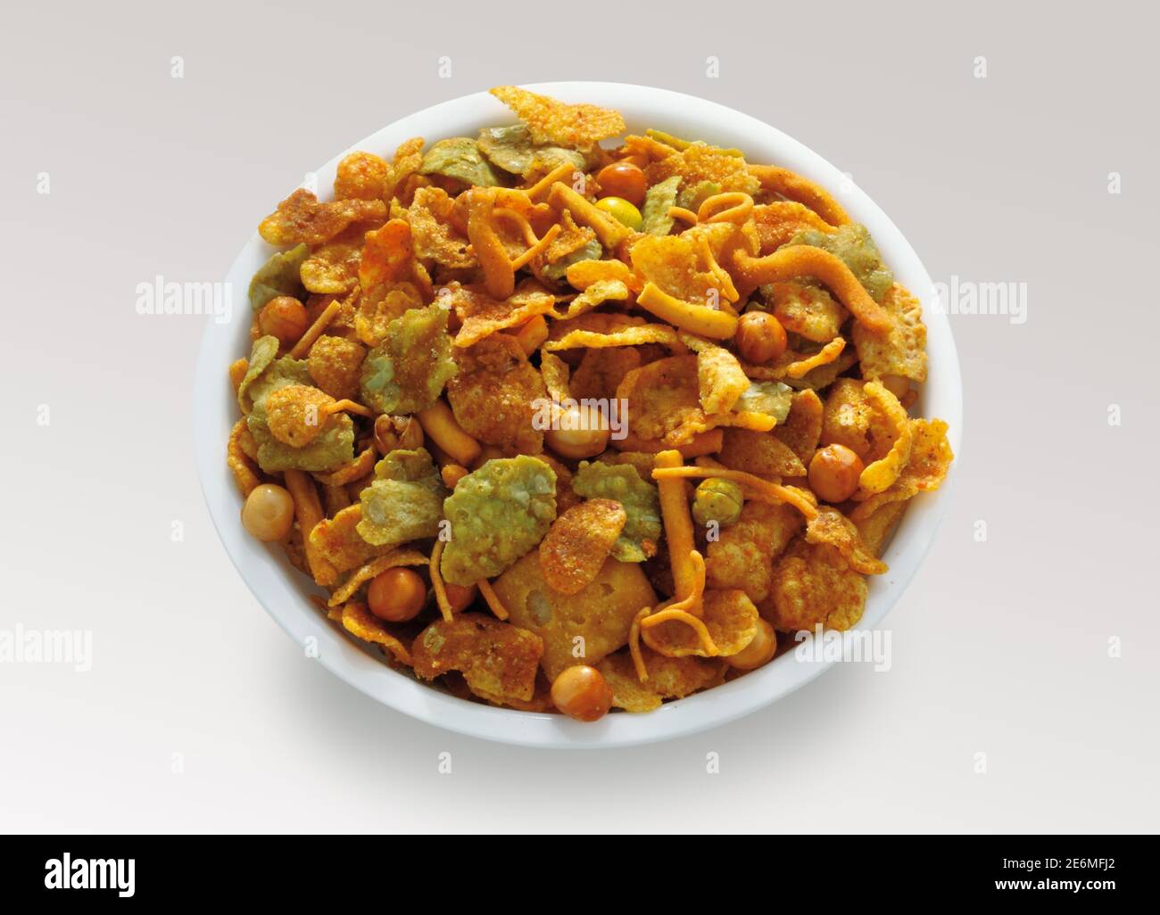 Delicious and crunchy Mix Nimco in golden antique bowl, Top shot of nimko, Traditional refreshment for tea time or evening brunch. Stock Photo
