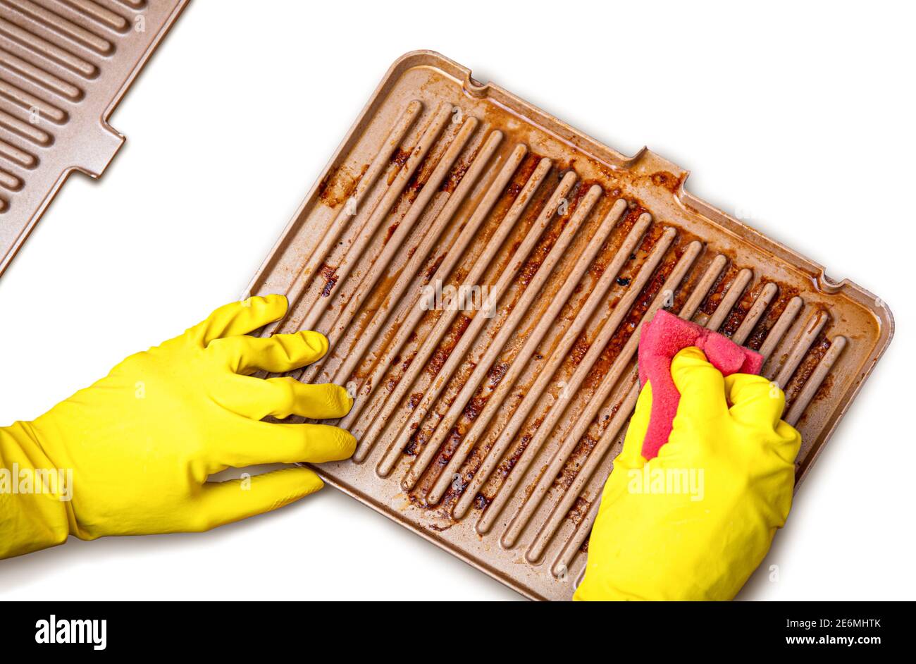 Grill after cooking. Steak marks on the electric home grill. Hand in