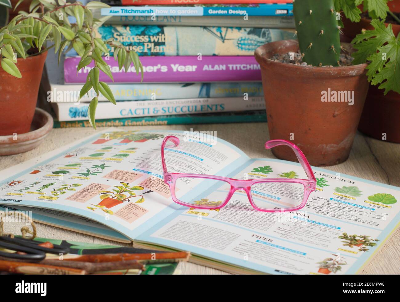 Gardening books and reading glasses in an English home. UK Stock Photo