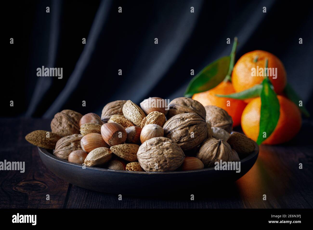 Mixed unshelled nuts with texture overlay Stock Photo