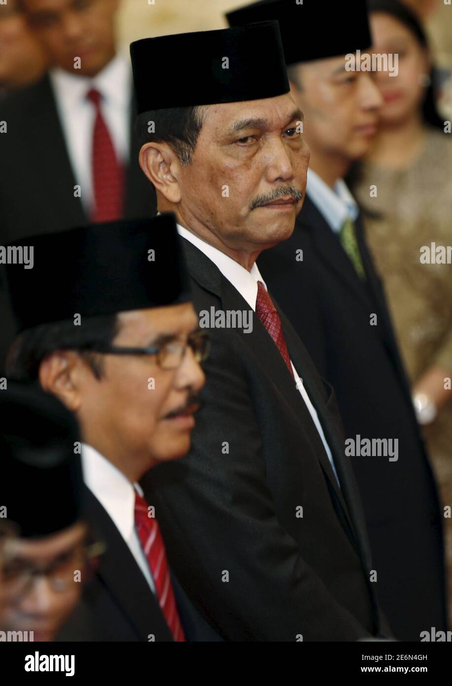 Indonesia S New Coordinating Minister For Security And Political Affairs Luhut Pandjaitan C Waits To Take The Oath At A Ceremony In The Presidential Palace In Jakarta Indonesia August 12 2015 The Biggest<script async src=