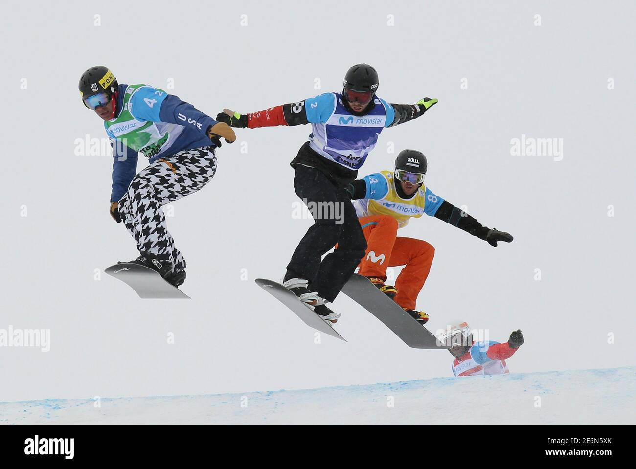 Snowboarding - FIS Snowboarding and Freestyle Skiing World Championships -  Men's Team Snowboard Cross - Sierra Nevada, Spain - 13/03/17 (L to R) Nick  Baumgartner of the US, Chris Robanske of Canada,