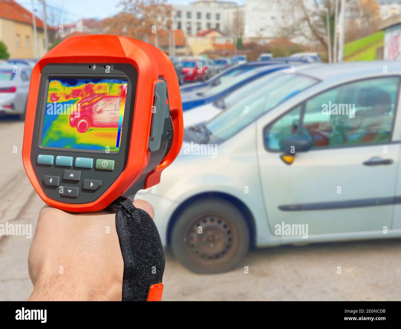 Recording with thermal camera showing parked cars at town parking a lot of Stock Photo
