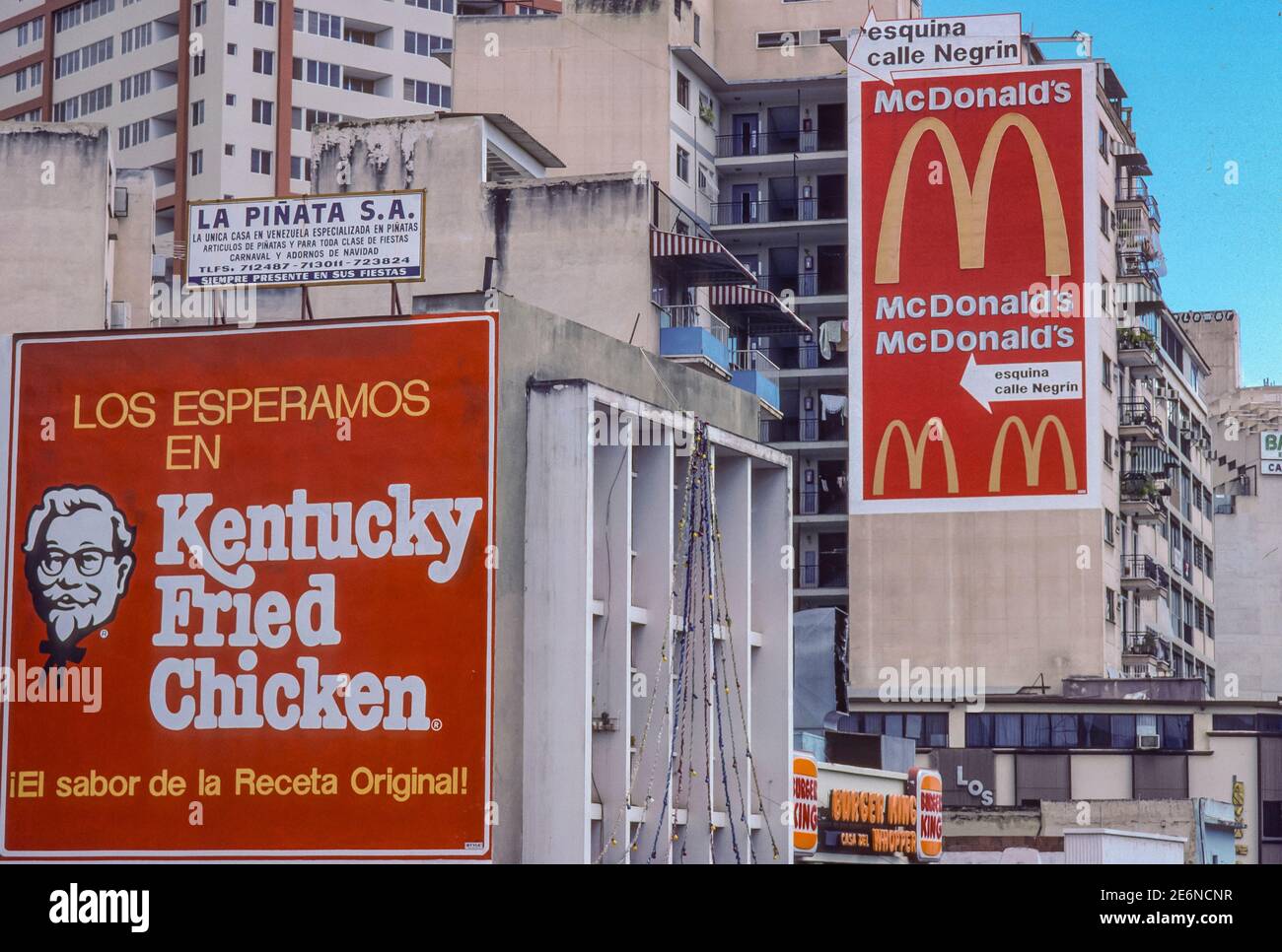 CARACAS, VENEZUELA, 1988 - Billboards on downtown buildings for McDonalds and Kentucky Fried Chicken. Stock Photo