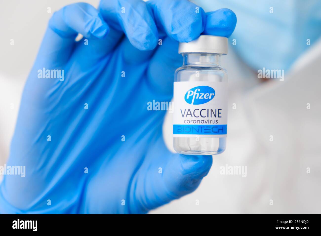 Pfizer coronavirus vaccine in doctors or nurses hands in blue rubber gloves. Prevention of sars-cov-2 or Covid-19, January 2021, San Francisco, USA Stock Photo