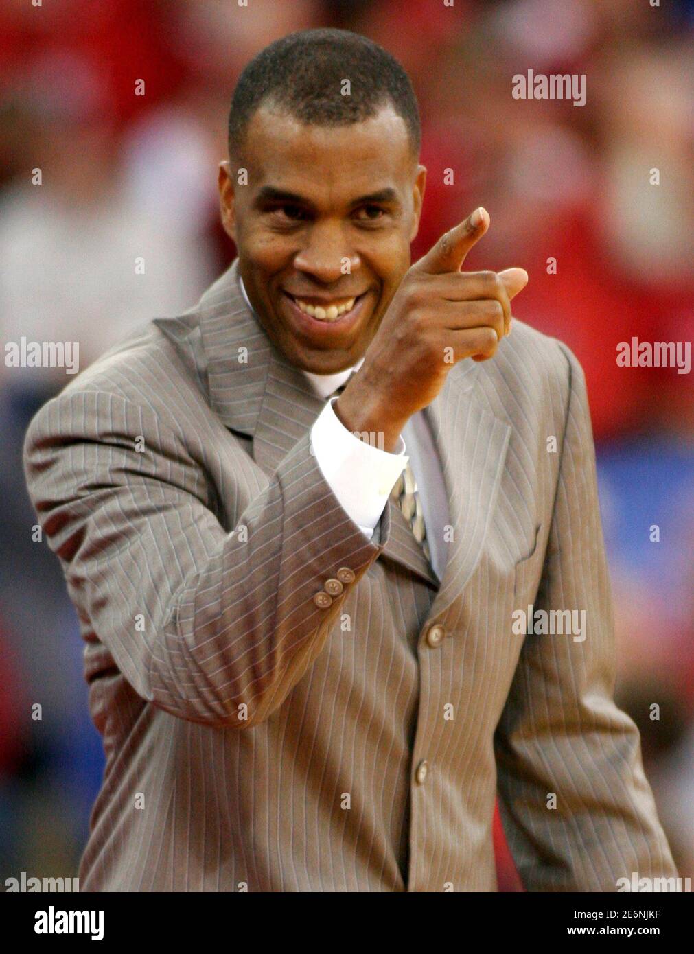 Indiana Hoosiers coach Mike Davis smiles while gesturing toward his players  during the first half of