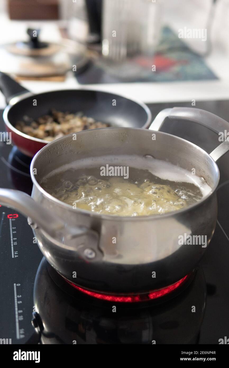 Boiling vegetables on stove hires stock photography and images Alamy