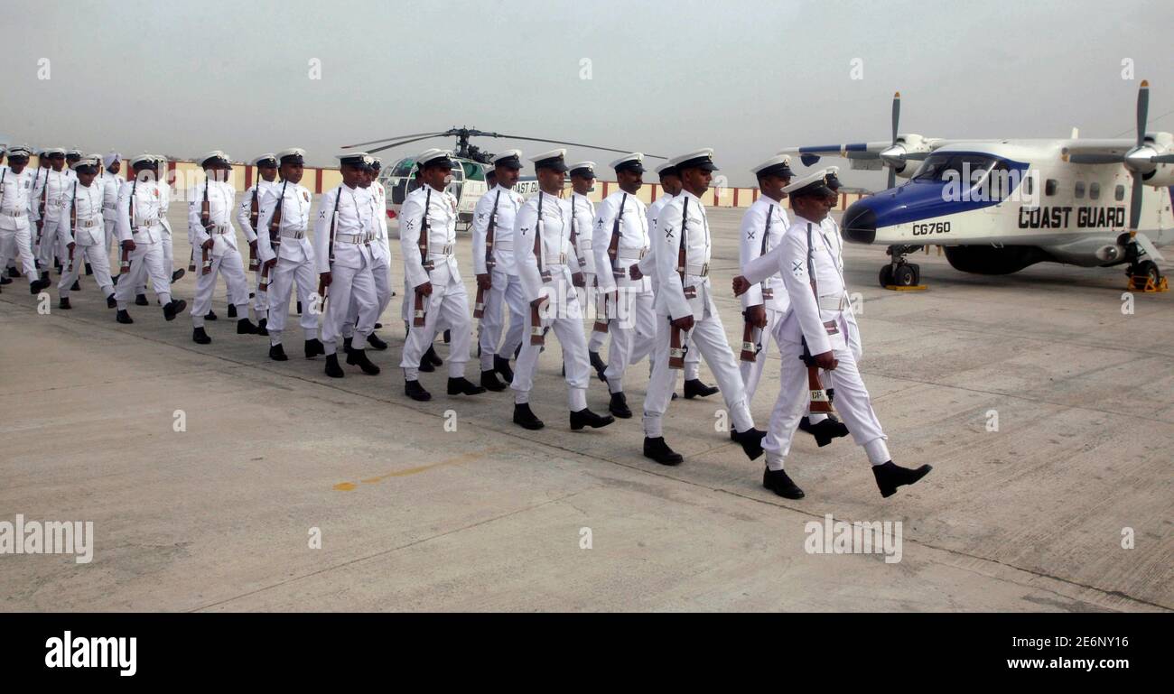 Sailors of Indian Coast Guard march during the commissioning ceremony of Air enclave at Porbandar, 415 km (258 miles) west of the western Indian city of Ahmedabad, June 12, 2008. Indian Coast Guard Air enclave at Porbandar is the first air base of the service in Gujarat. The unit is safeguarding vast 1600 km (994 miles) coastline which includes sensitive international Maritime border with Pakistan, monitoring dense merchant ships traffic in gulf areas and surveillance in adjoining Exclusive Economic Zone (EEZ), a press release of Indian Coast Guard said.  REUTERS/Amit Dave  (INDIA) Stock Photo