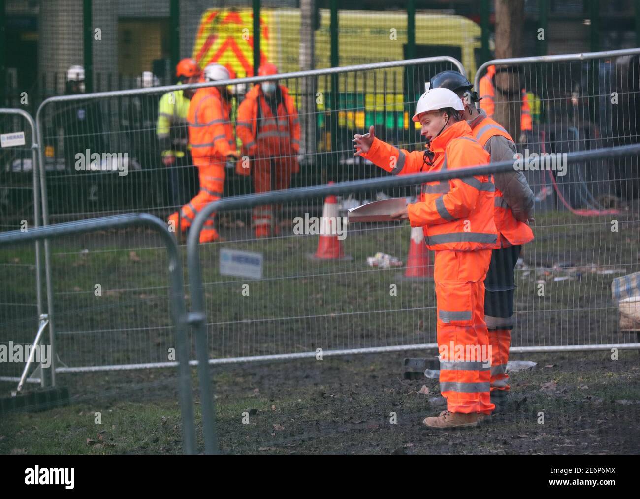 Contractors working in Euston Square Gardens in central London, where protesters have built a 100ft tunnel network, which they are ready to occupy, after claiming the garden is at risk from the HS2 line development. Picture date: Friday January 29, 2021. Stock Photo